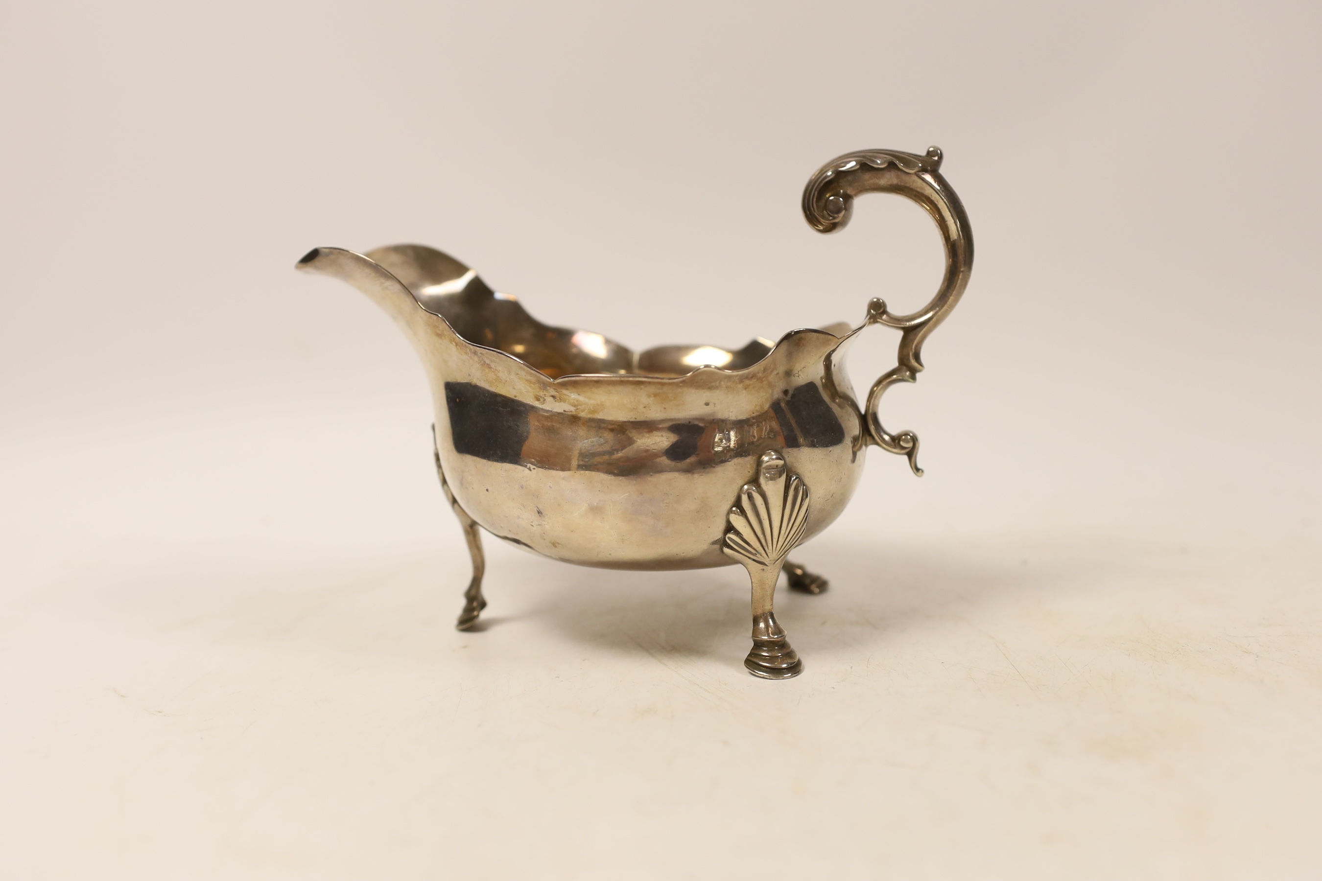 A George III silver sauce boat, with flying scroll handle, George Smith III, London, 1770, length 17.5cm, 9.9oz.